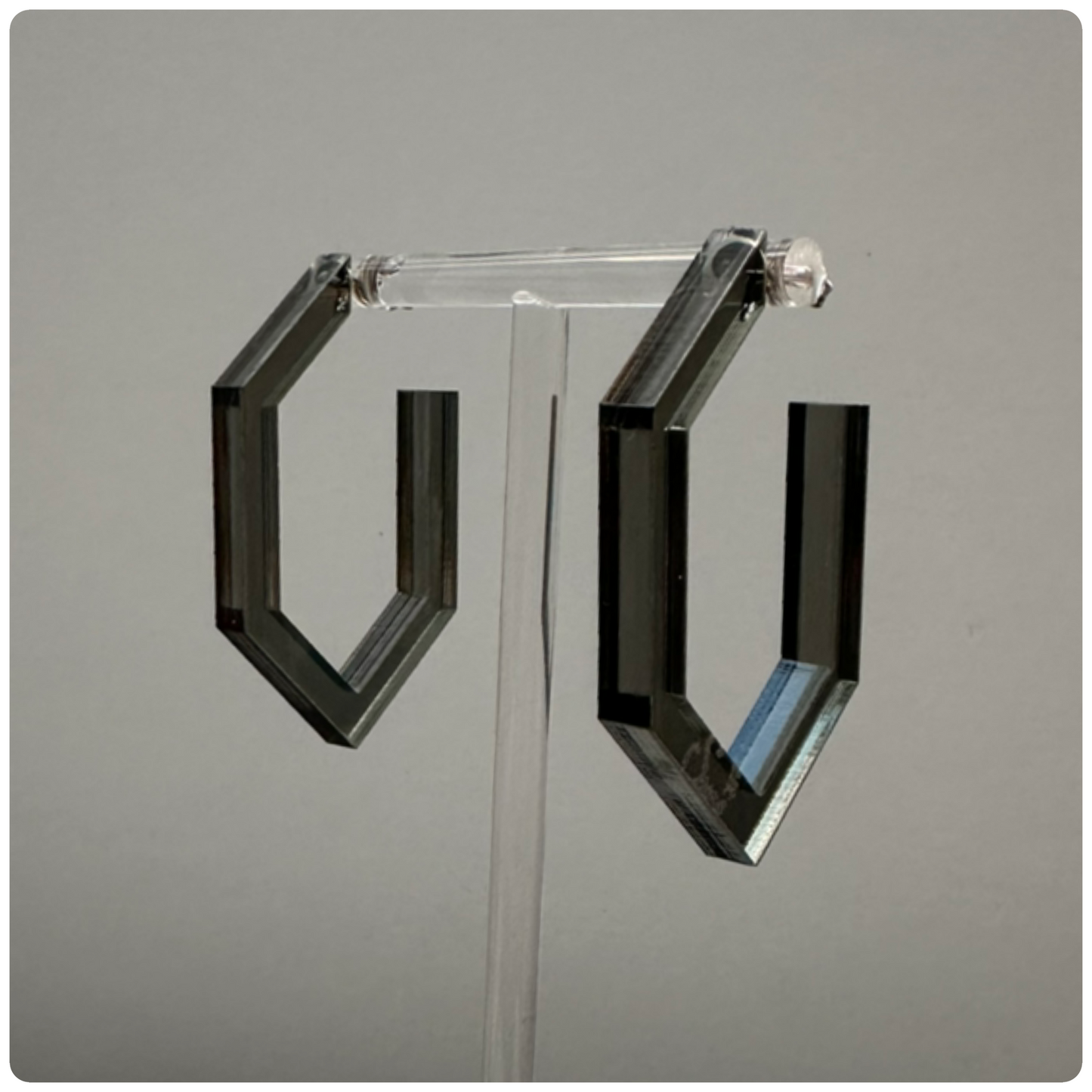 Lucite Modern Hoop Earrings
Handcrafted in the USA | Unique Statement Pieces

Add a bold touch of color and modern elegance with these stunning handcrafted Lucite hoop earrings. Made with sterling silver posts, these hoops are available in three eye-catching colors: neon yellow, neon pink, and smokey grey. A perfect way to elevate your style with a pop of vibrant color!