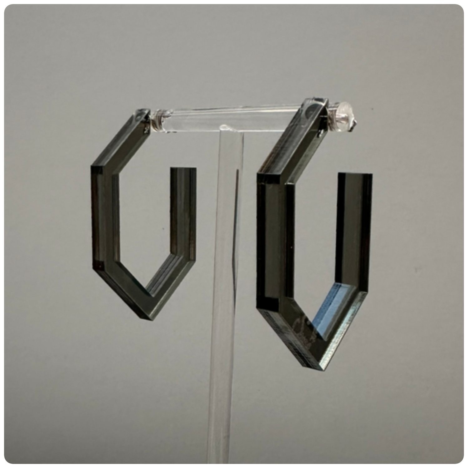 Lucite Modern Hoop Earrings
Handcrafted in the USA | Unique Statement Pieces

Add a bold touch of color and modern elegance with these stunning handcrafted Lucite hoop earrings. Made with sterling silver posts, these hoops are available in three eye-catching colors: neon yellow, neon pink, and smokey grey. A perfect way to elevate your style with a pop of vibrant color!