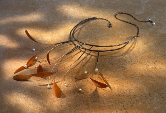 Isadora Necklace: Dazzling Oxidized Sterling Silver, 18k gold and Orange Feather Neckpiece